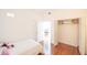 Small bedroom with twin bed and access to hallway at 9055 Treasure Trove Ln # 206, Kissimmee, FL 34747