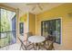 Covered patio with seating area, ceiling fan, and sliding glass doors at 9055 Treasure Trove Ln # 206, Kissimmee, FL 34747