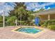 Relaxing hot tub with surrounding landscaping at 9055 Treasure Trove Ln # 206, Kissimmee, FL 34747