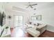 Comfortable living room featuring hardwood floors and a sectional sofa at 9055 Treasure Trove Ln # 206, Kissimmee, FL 34747
