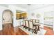 Bright dining room with hardwood floors and a large wooden table at 9055 Treasure Trove Ln # 206, Kissimmee, FL 34747