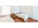 Bedroom with two twin beds and wood nightstand at 9055 Treasure Trove Ln # 206, Kissimmee, FL 34747