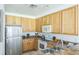 Modern kitchen with stainless steel appliances at 9055 Treasure Trove Ln # 206, Kissimmee, FL 34747