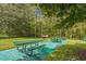 Community picnic area with grills and shaded tables at 9055 Treasure Trove Ln # 206, Kissimmee, FL 34747