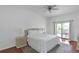 Bright bedroom with king-size bed and access to balcony at 9055 Treasure Trove Ln # 206, Kissimmee, FL 34747