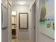 Bright hallway with artwork and access to bedrooms and bath at 550 Birch Ct, Altamonte Springs, FL 32714