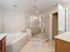 Bathroom with a corner soaking tub and a walk-in shower at 452 Harbor Winds Ct, Winter Springs, FL 32708