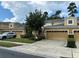 Two-story townhome with double garage and neatly landscaped yard at 452 Harbor Winds Ct, Winter Springs, FL 32708
