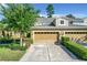 Two-story townhome with a two car garage and manicured lawn at 452 Harbor Winds Ct, Winter Springs, FL 32708