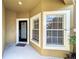 Inviting entryway with black door and two large windows at 452 Harbor Winds Ct, Winter Springs, FL 32708