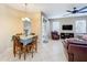 Bright dining area with table and chairs, adjacent to living room at 452 Harbor Winds Ct, Winter Springs, FL 32708