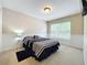 Bright bedroom with double bed and window at 452 Harbor Winds Ct, Winter Springs, FL 32708