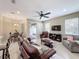 Open concept living room with a view of kitchen and dining areas at 452 Harbor Winds Ct, Winter Springs, FL 32708