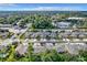 An expansive aerial view of a residential neighborhood nestled amidst greenery at 452 Harbor Winds Ct, Winter Springs, FL 32708