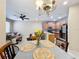Bright dining area with a view of the living room and kitchen at 452 Harbor Winds Ct, Winter Springs, FL 32708