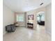 Living room features neutral colors, tile floors and an open floorplan at 452 Harbor Winds Ct, Winter Springs, FL 32708