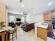 Open living room with leather furniture and a ceiling fan at 452 Harbor Winds Ct, Winter Springs, FL 32708