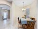 Charming dining area with table and chairs, near entryway at 452 Harbor Winds Ct, Winter Springs, FL 32708