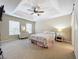 Spacious main bedroom with a queen bed and ensuite bathroom at 452 Harbor Winds Ct, Winter Springs, FL 32708