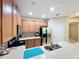 Modern kitchen with stainless steel appliances and wood cabinets at 452 Harbor Winds Ct, Winter Springs, FL 32708