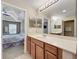 Double vanity bathroom with a view into the bedroom at 452 Harbor Winds Ct, Winter Springs, FL 32708