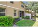 Landscaped backyard with a screened patio at 452 Harbor Winds Ct, Winter Springs, FL 32708