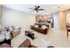 Spacious living room featuring a leather couch and access to kitchen at 452 Harbor Winds Ct, Winter Springs, FL 32708