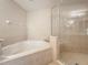 Bathroom with corner jacuzzi tub and separate shower stall at 452 Harbor Winds Ct, Winter Springs, FL 32708