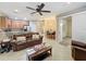 Open living space with kitchen, dining, and access to back patio at 452 Harbor Winds Ct, Winter Springs, FL 32708