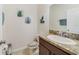 Clean bathroom with granite countertop and dark brown vanity at 3349 Rodrick Cir, Orlando, FL 32824