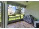 Spacious screened patio, includes tile flooring and a grill at 3349 Rodrick Cir, Orlando, FL 32824
