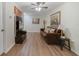 Cozy bonus room featuring hardwood floors and a leather couch at 3349 Rodrick Cir, Orlando, FL 32824