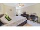 Well-lit bedroom with a built-in desk and ceiling fan at 3349 Rodrick Cir, Orlando, FL 32824