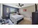 Comfortable bedroom with a ceiling fan and dark-colored walls at 3349 Rodrick Cir, Orlando, FL 32824