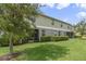 Landscaped exterior, showcasing a two-story building with lush lawn at 3349 Rodrick Cir, Orlando, FL 32824