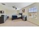 Spacious bedroom with carpeted floor, dresser, and mini-fridge at 3349 Rodrick Cir, Orlando, FL 32824