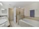 Modern bathroom with a soaking tub and walk-in shower at 3349 Rodrick Cir, Orlando, FL 32824