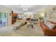 Open living room with comfortable seating, view of kitchen and dining room at 3349 Rodrick Cir, Orlando, FL 32824