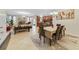 Open dining room with six chairs, table and view into living room at 3349 Rodrick Cir, Orlando, FL 32824