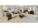 Bright living room with comfortable seating, large TV, and tile flooring at 3349 Rodrick Cir, Orlando, FL 32824