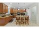 Spacious kitchen with island, stainless steel appliances, and wood cabinets at 3349 Rodrick Cir, Orlando, FL 32824