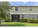 Well-maintained exterior, featuring a screened patio and landscaping at 3349 Rodrick Cir, Orlando, FL 32824
