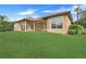 Expansive grassy backyard with mature trees and hedge at 9106 Panzani Pl, Windermere, FL 34786