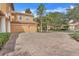 Brick driveway and two car garage of two story house at 9106 Panzani Pl, Windermere, FL 34786