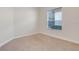 Bright bedroom with neutral carpeting and large window at 9106 Panzani Pl, Windermere, FL 34786
