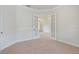 Spacious bedroom with double doors and neutral carpeting at 9106 Panzani Pl, Windermere, FL 34786