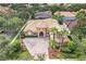 Luxury home with tile roof, driveway, and lush landscaping at 9106 Panzani Pl, Windermere, FL 34786