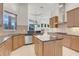 Modern kitchen with island, granite countertops, and stainless steel appliances at 9106 Panzani Pl, Windermere, FL 34786