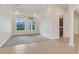 Large living room with grey carpet, tile floors, and lots of natural light at 9106 Panzani Pl, Windermere, FL 34786