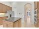Kitchen with island, granite countertops, and stainless steel appliances at 9106 Panzani Pl, Windermere, FL 34786